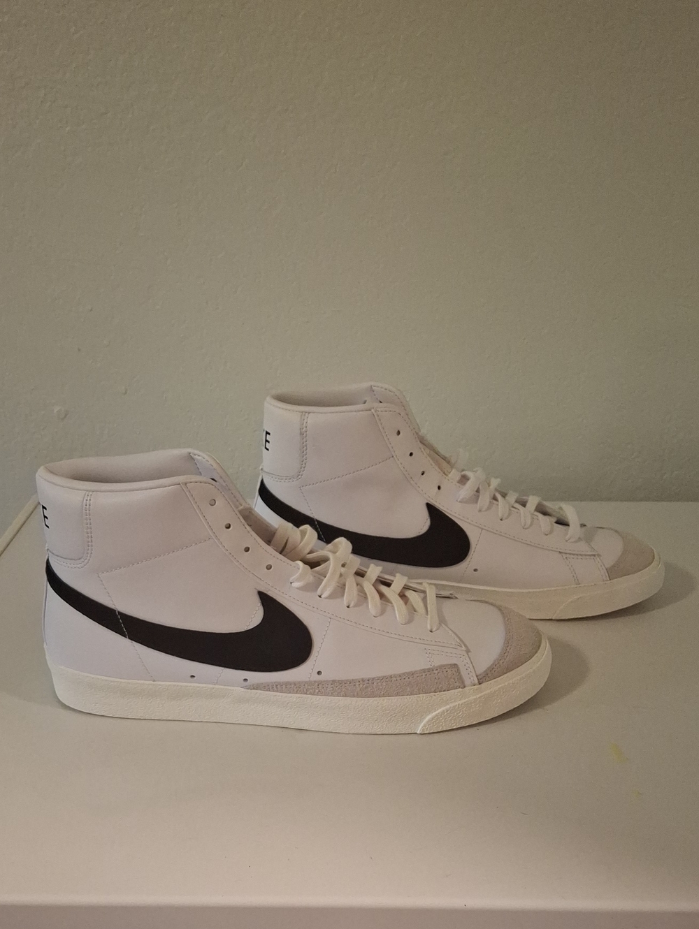 Nike Men’s White High-Top Sneakers with Black Swoosh Accent